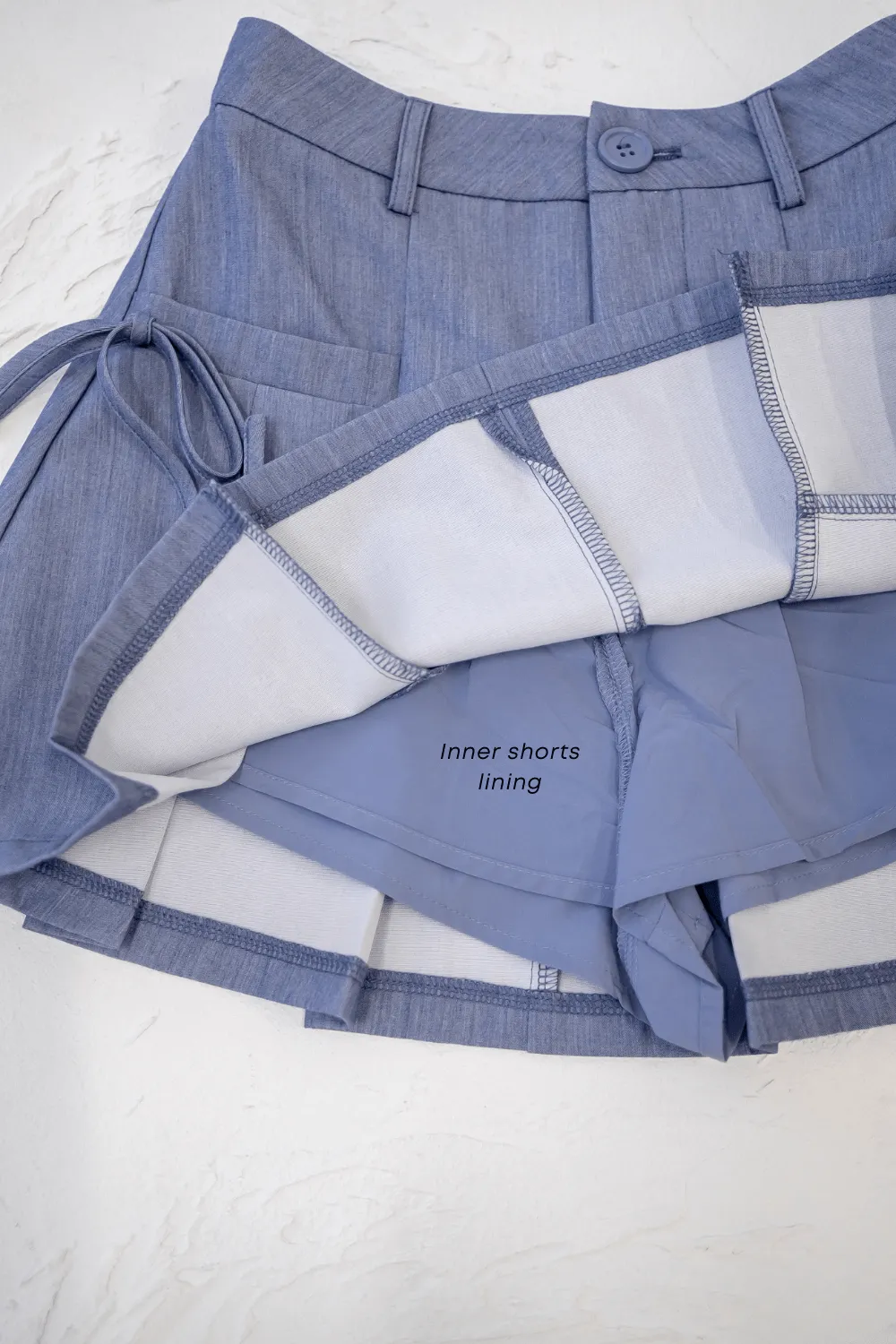 CLARE PLEATED TIE-KNOT SKORTS IN BLUE