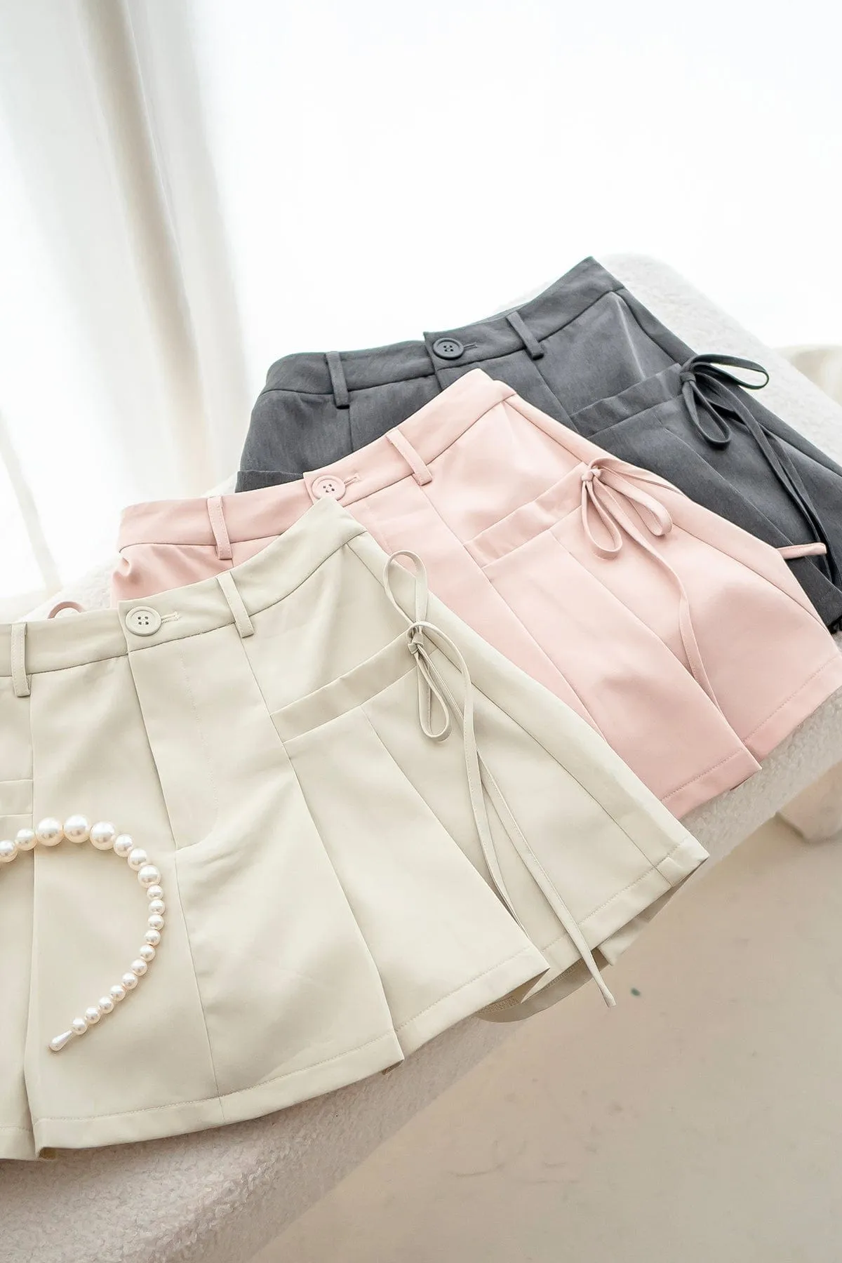 CLARE PLEATED TIE-KNOT SKORTS IN PINK