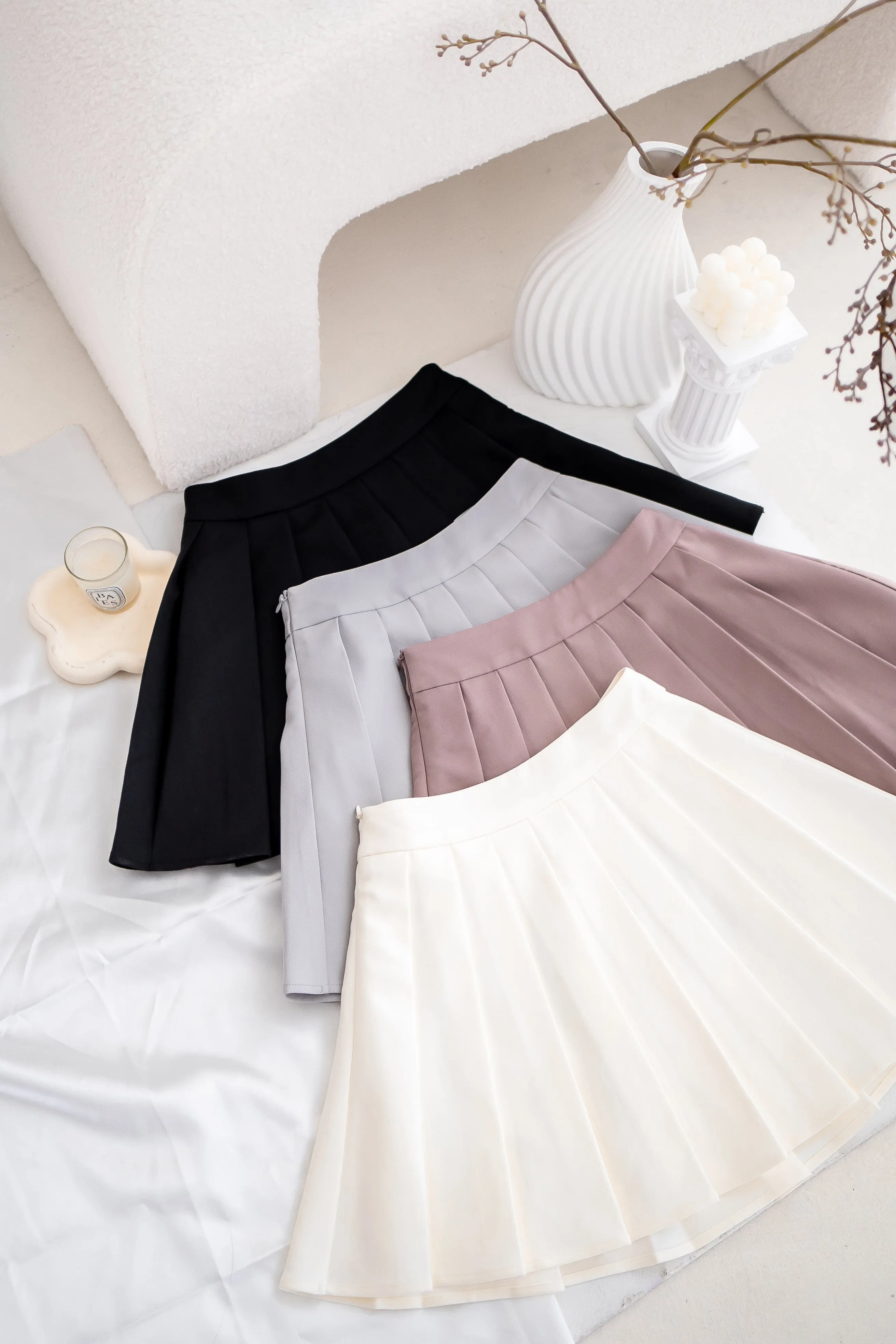 RESTOCKED** CAMU PLEATED SKIRT IN CREAM WHITE