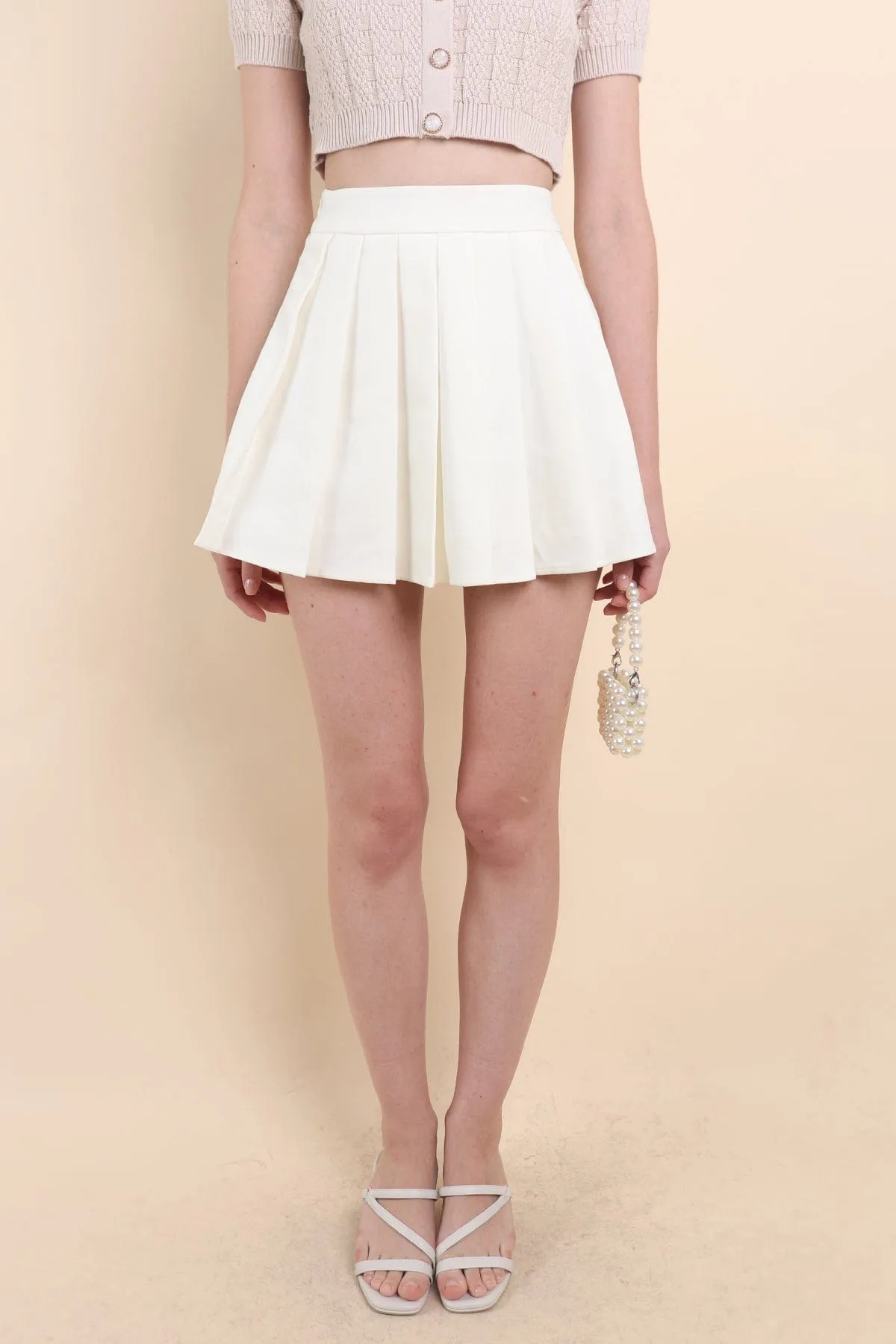 RESTOCKED** CAMU PLEATED SKIRT IN CREAM WHITE